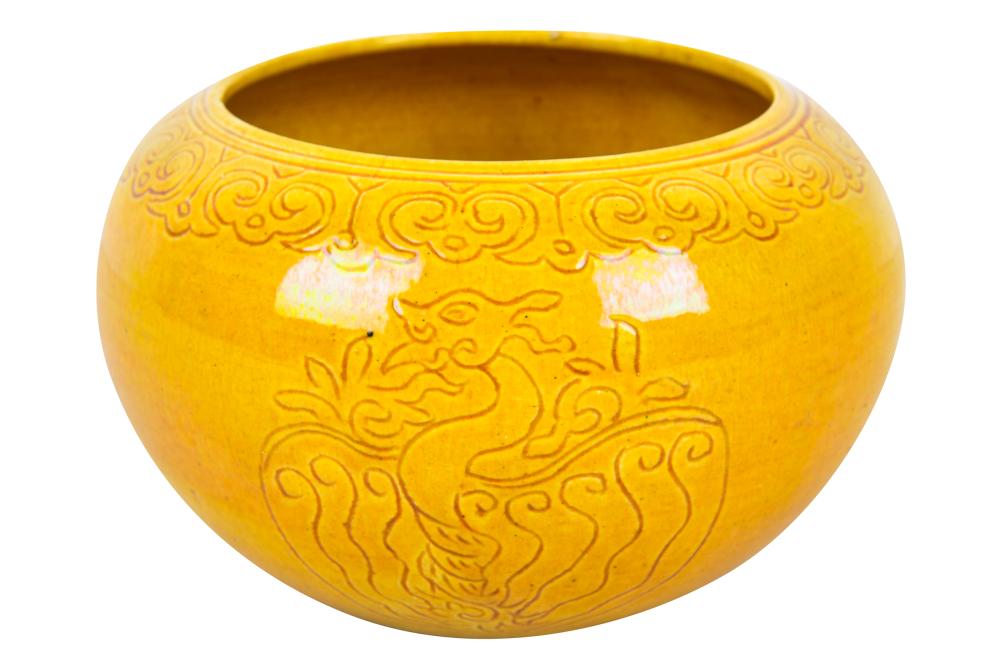 Appraisal: CHINESE YELLOW-GLAZED CERAMIC BOWLwith incised dragon design inches wide inches