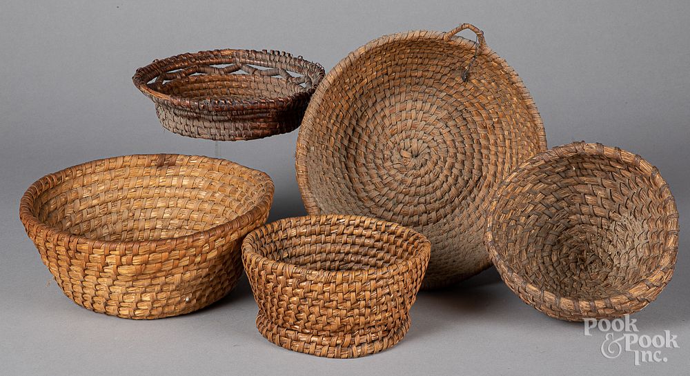 Appraisal: Five rye straw baskets ca Five rye straw baskets ca