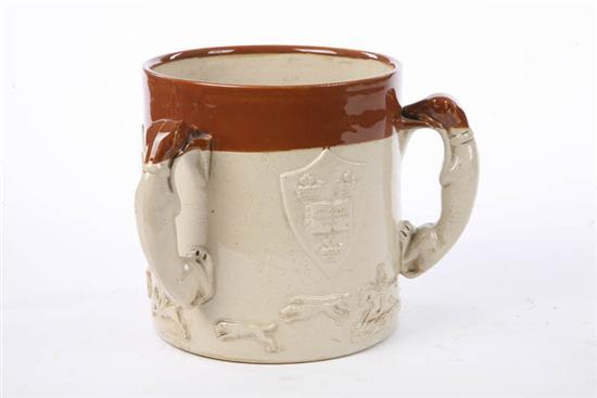 Appraisal: TRIPLE HOUND HANDLED LOVING CUP Cream colored glaze with a