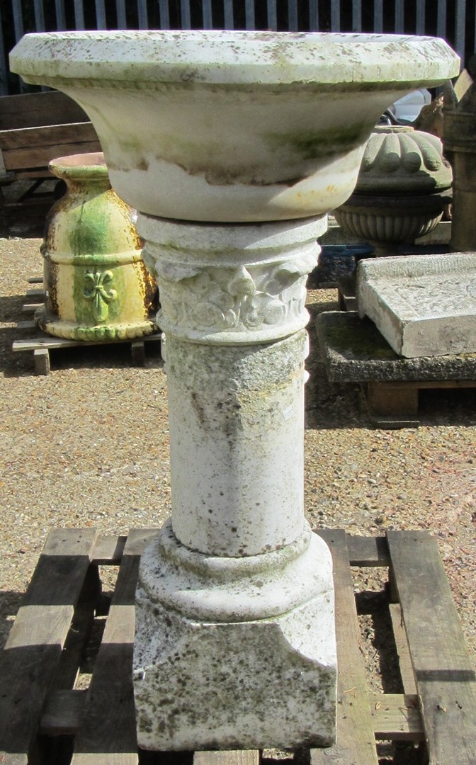 Appraisal: A pair of carved marble bowls on turned stands and