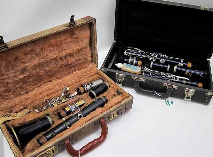 Appraisal: TWO CLARINET MUSICAL INSTRUMENTS one marked ''Parisian Ambassador'' by F