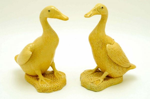 Appraisal: A pair of Chinese porcelain ducks in yellow glaze Stamped