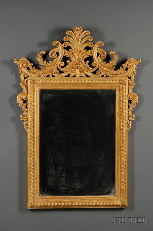 Appraisal: Pair of Rococo Revival Giltwood Mirrors th century each with