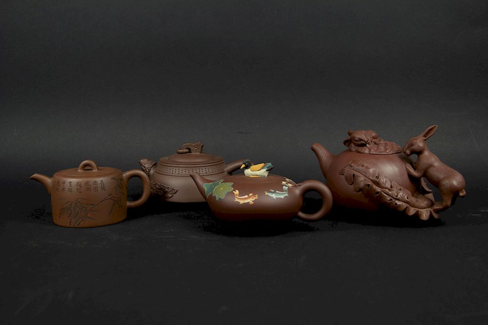 Appraisal: Group of Four Yixing Teapots Including a teapot in the