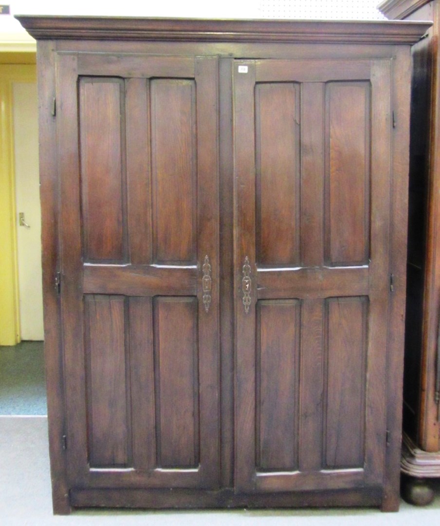 Appraisal: An th century oak two door hanging cupboard on stile