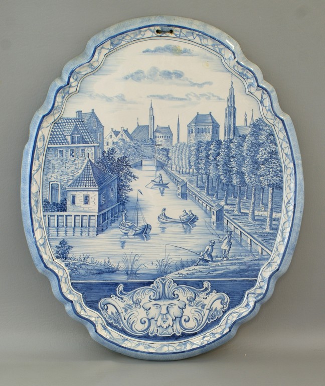 Appraisal: Tin glazed Delft pottery wall plaque with canal scene with