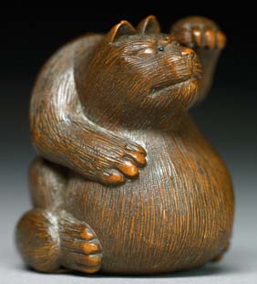 Appraisal: ANTIQUE WOOD NETSUKE Well carved and antique carved wood netsuke