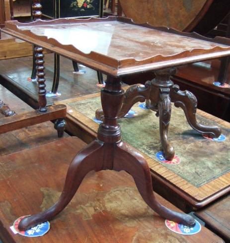 Appraisal: A George III mahogany silver table the rectangular top with