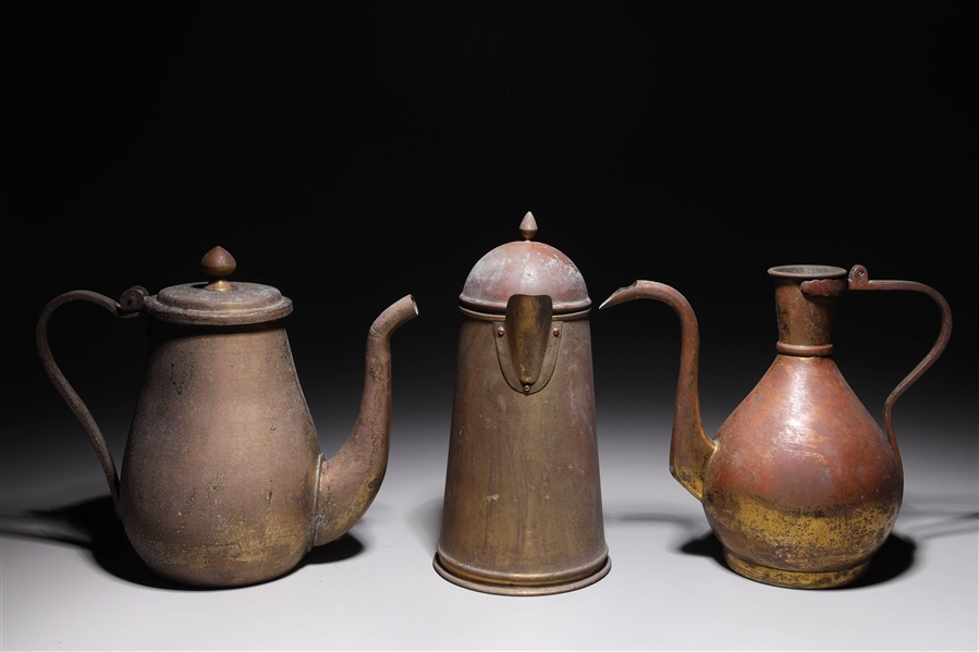 Appraisal: Group of three bronze or copper alloy ewers likely th