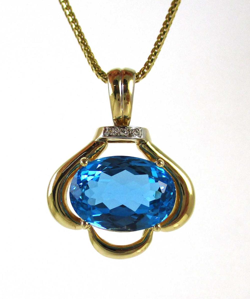 Appraisal: BLUE TOPAZ DIAMOND AND FOURTEEN KARAT GOLD PENDANT NECKLACE with