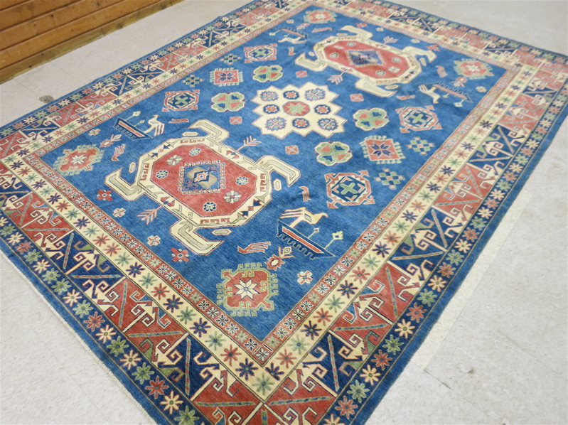 Appraisal: HAND KNOTTED ORIENTAL CARPET Pakistani Caucasian overall geometric design on