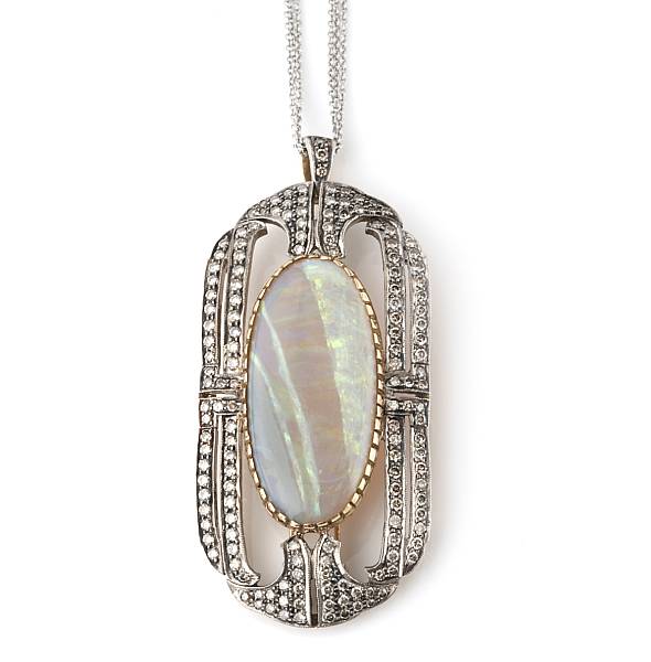 Appraisal: An oval opal diamond and two-tone gold pendant with chain