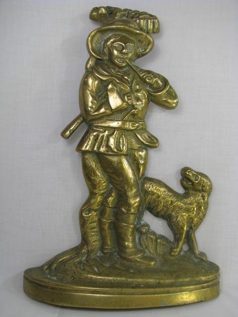 Appraisal: English solid brass doorstop of a man smoking a pipe