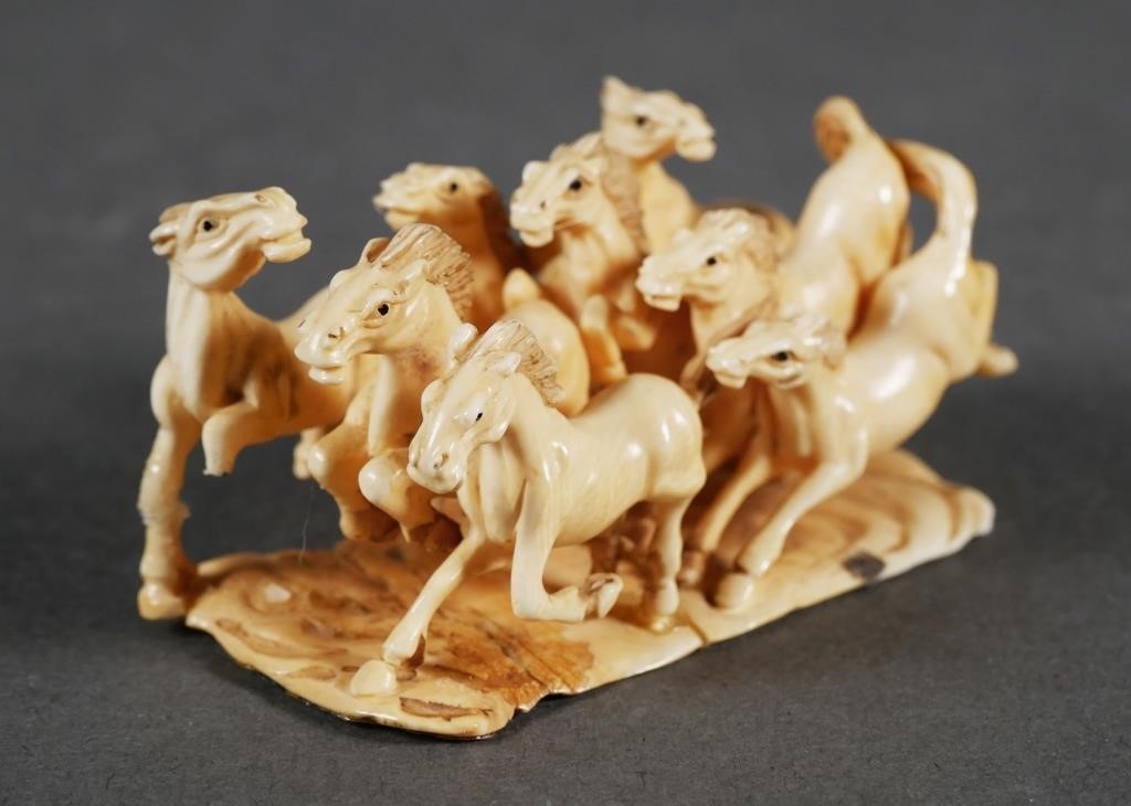 Appraisal: Finely carved Japanese ivory netsuke of eight wild horses Signed