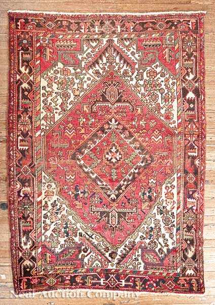 Appraisal: A Persian Heriz Carpet red and cream ground central geometric