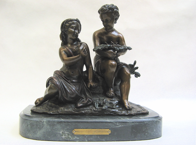 Appraisal: POLYCHROME BRONZE SCULPTURE AFTER A CARRIER of a young boy