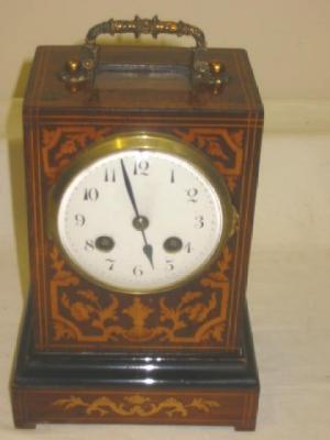 Appraisal: A VICTORIAN MANTEL CLOCK the French eight day movement with