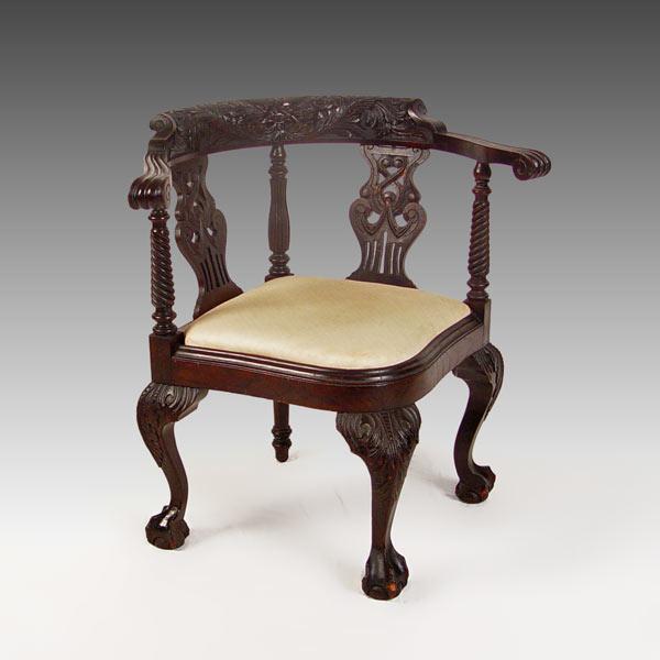 Appraisal: EARLY VICTORIAN BLACK WALNUT CORNER CHAIR Heavily carved back with