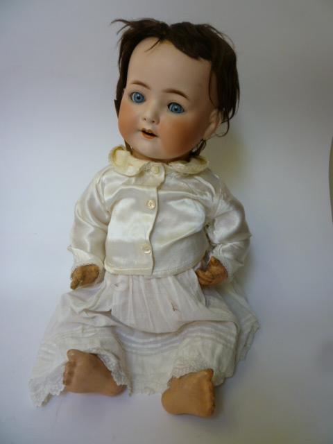 Appraisal: An Ernst Heubach bisque head doll with blue glass sleeping