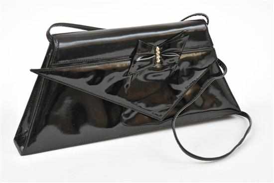 Appraisal: A MALIK SHOULDER BAG BY ROLAND PIERRE The sharp angled