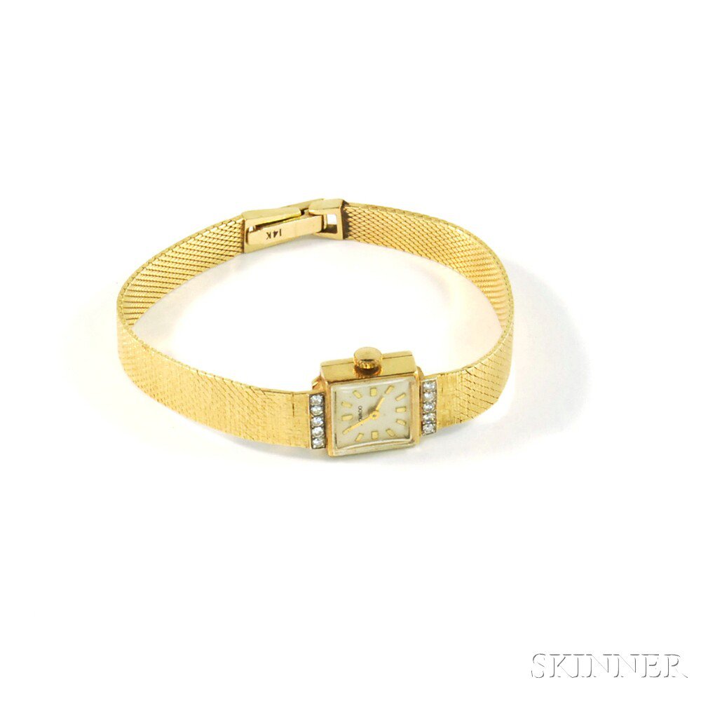 Appraisal: kt Gold and Diamond Lady's Movado Bracelet Wristwatch with baton