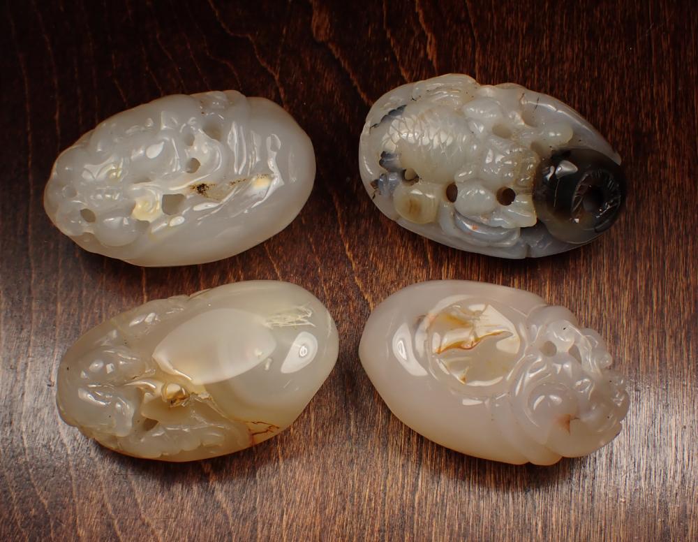 Appraisal: FOUR CHINESE CARVED AGATE HARDSTONES in a variety of carved