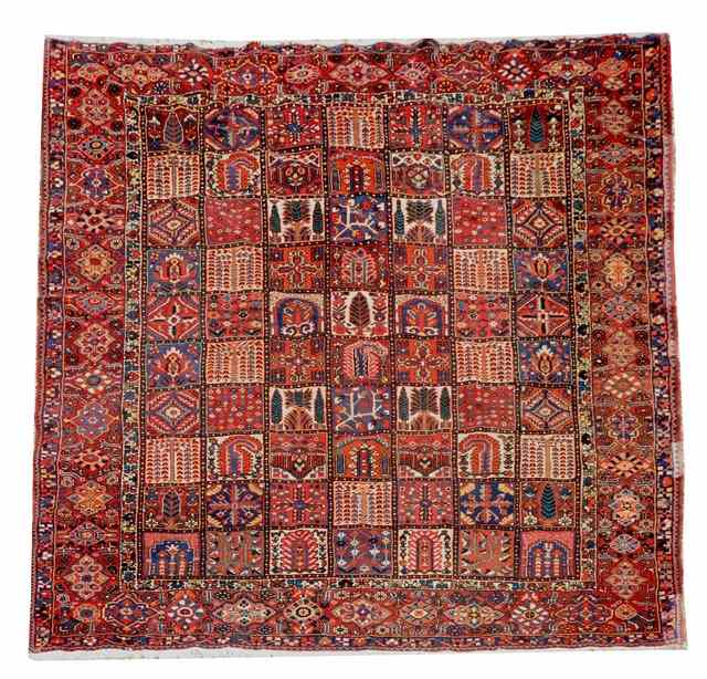 Appraisal: AN OLD PERSIAN BAKHTIARI CARPET decorated central compartmented field of