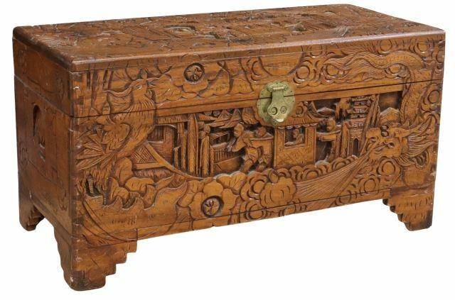 Appraisal: Chinese carved storage trunk likely camphor wood th c relief