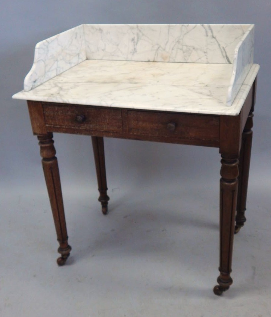 Appraisal: A William IV mahogany wash stand with a white marble