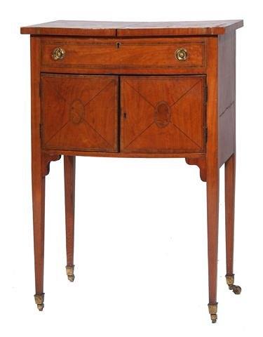 Appraisal: A VICTORIAN SATINWOOD SEWING TABLE with fitted interior enclosed by