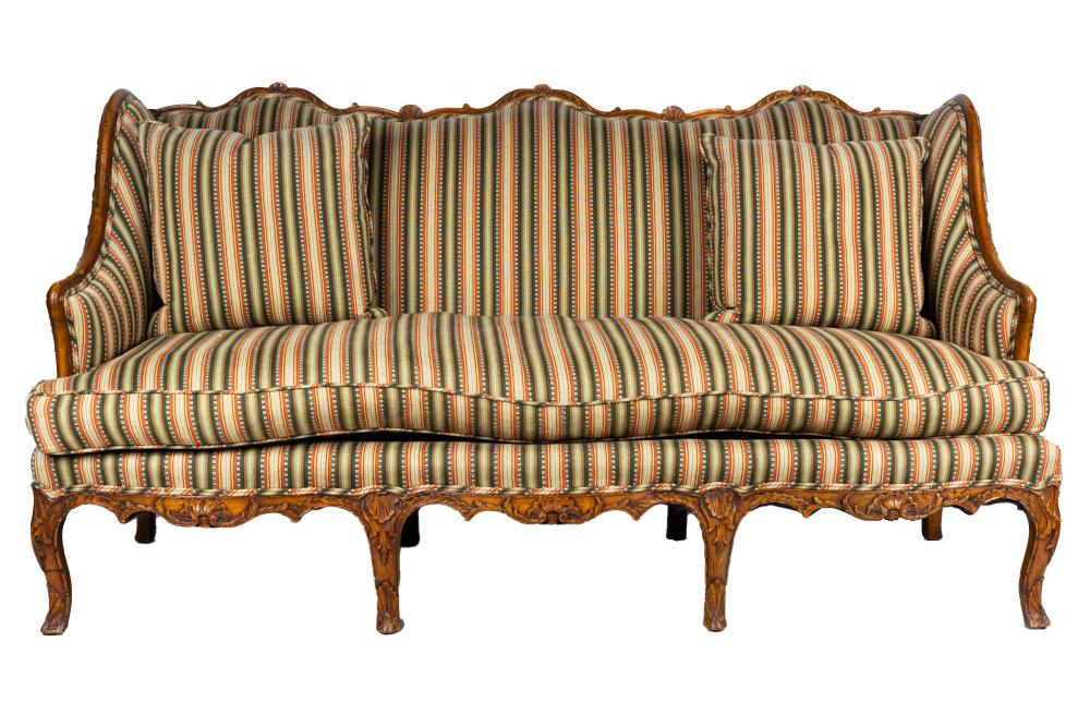 Appraisal: LOUIS XV CARVED WALNUT CANAPEupholstered with Cowan and Tout green