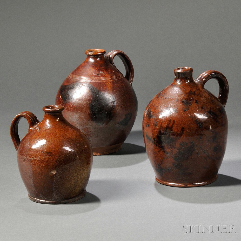 Appraisal: Three Redware Jugs America early th century ovoid form with