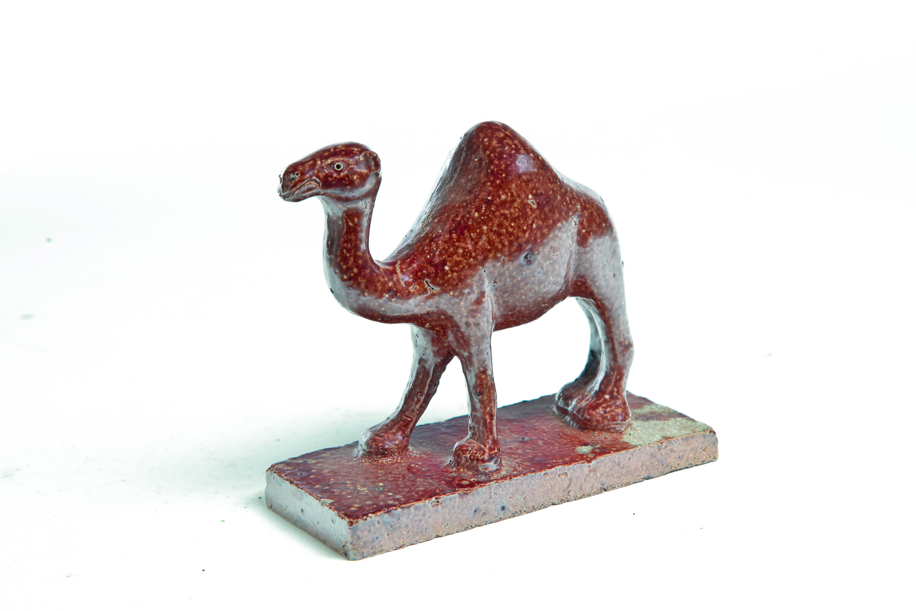 Appraisal: OHIO SEWERTILE CAMEL Mid th century Standing camel h incised