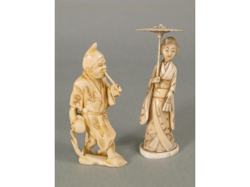 Appraisal: Two late th Century Japanese carved ivory figures with parasols