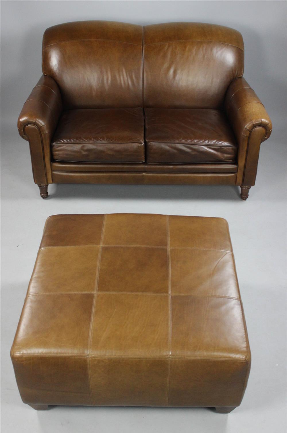 Appraisal: ENGLISH CLUB STYLE BROWN LEATHER SETTEE AND COORDINATING LEATHER OTTOMAN