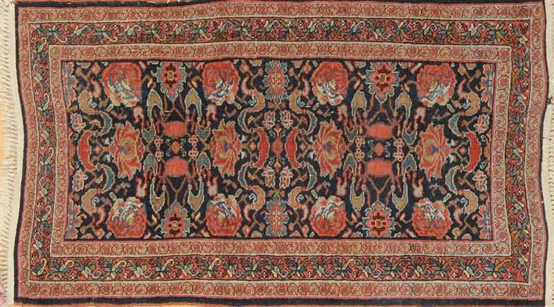 Appraisal: PERSIAN COBALT-GROUND RUG Worked with rose heads and lotus within