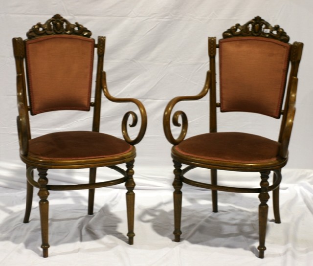 Appraisal: A pair of bentwood open armchairs in beech and dusty