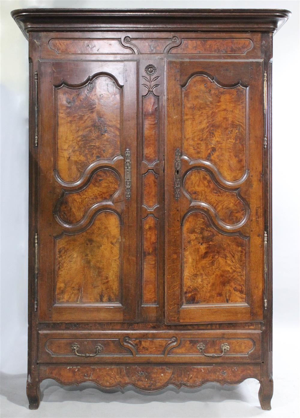 Appraisal: FRENCH PROVINCIAL TH CENTURY OAK AND WALNUT ARMOIRE having an