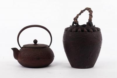 Appraisal: A Japanese cast iron Ikebana with swing handle and a