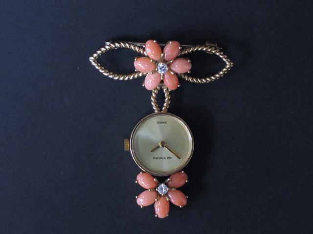 Appraisal: A GARRARDS GOLD PENDANT WATCH BROOCH the plain gilt dial