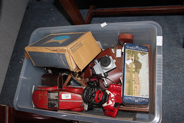 Appraisal: A RED PAINTED CLOCKWORK TIN CAR together with a Tri-ang