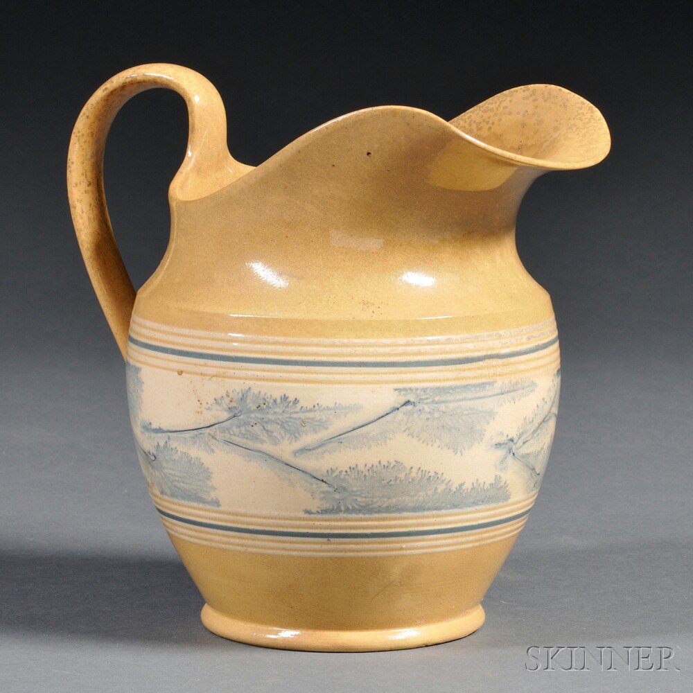 Appraisal: Yellowware Pitcher with Band of Blue Mocha Seaweed Decoration North