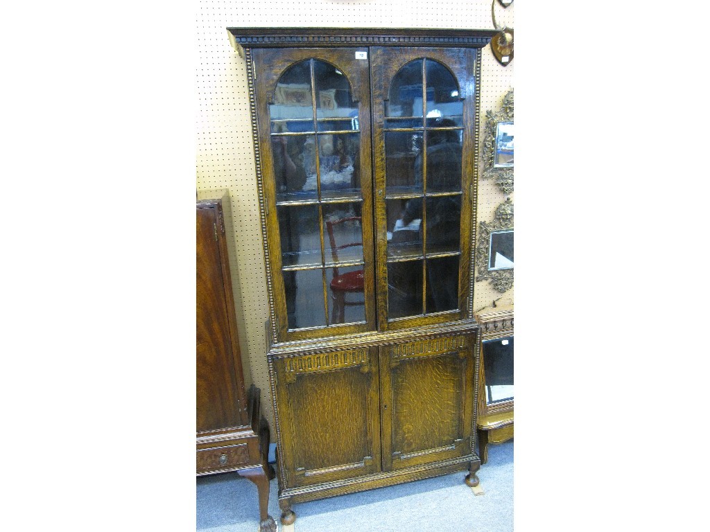 Appraisal: Oak glazed door bookcase on cabinet