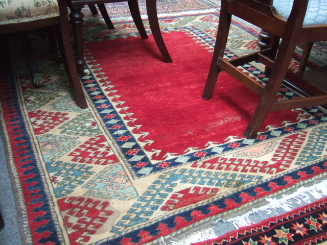 Appraisal: A Caucasian rug of Bordjolu design the plain madder field