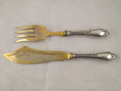 Appraisal: A pair of fish servers with gilt blades and silver