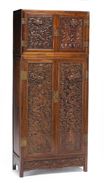 Appraisal: A pair of mixed wood two-section cabinets with carved dragon