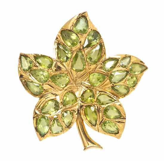 Appraisal: A Vintage Yellow Gold and Peridot Leaf Brooch containing pear