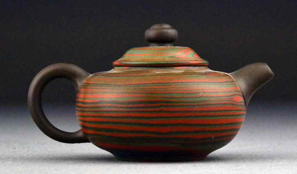 Appraisal: Chinese Qing Yixing Pottery Tea PotFinely painted in colorful bands