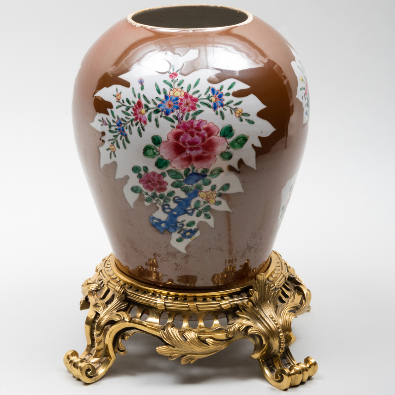 Appraisal: CHINESE GILT-METAL-MOUNTED CAF -AU-LAIT GROUND PORCELAIN JAR Unmarked The jar