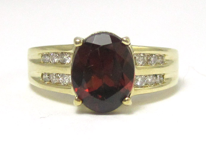 Appraisal: RHODOLITE GARNET AND DIAMOND RING k yellow gold with six